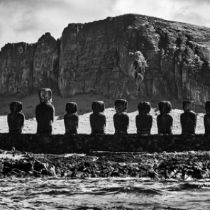 Showing scale on the Island – below the third Moai from the left, there are two people walking…