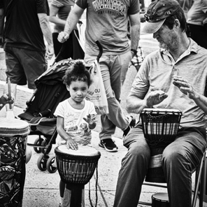 July First Friday • Duke Thompson keeping drum circle rhythm along with a very small friend…