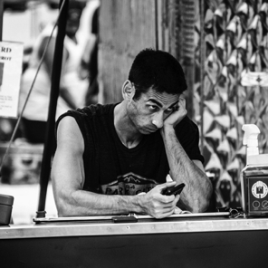 July 2018 • A long lens allowed me to catch this expression at one of the booths.
