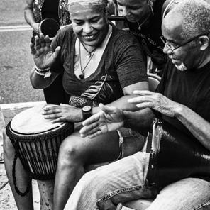 July 2018 • Cliff Giles, Drum Circle leader, gives a little help